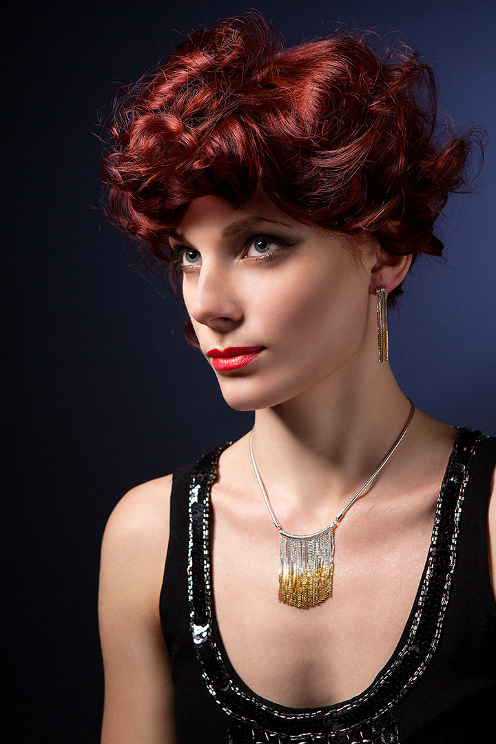 model shot of silver dangly chain and oxidised silver earrings