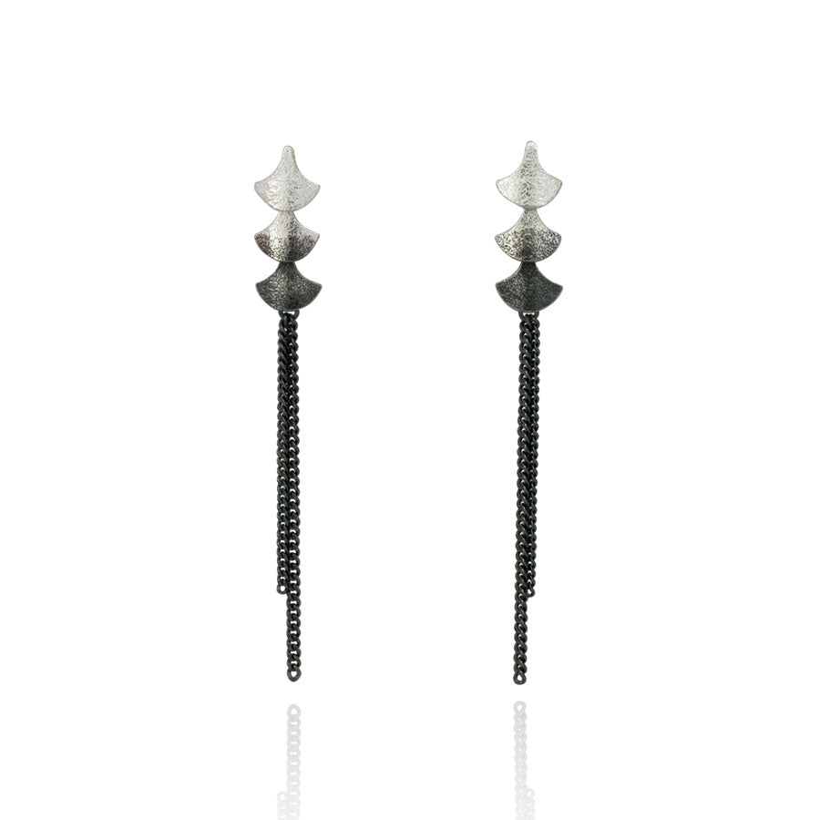 Silver shorter dangly earrings with oxidised chains and silver teardrop shapes.