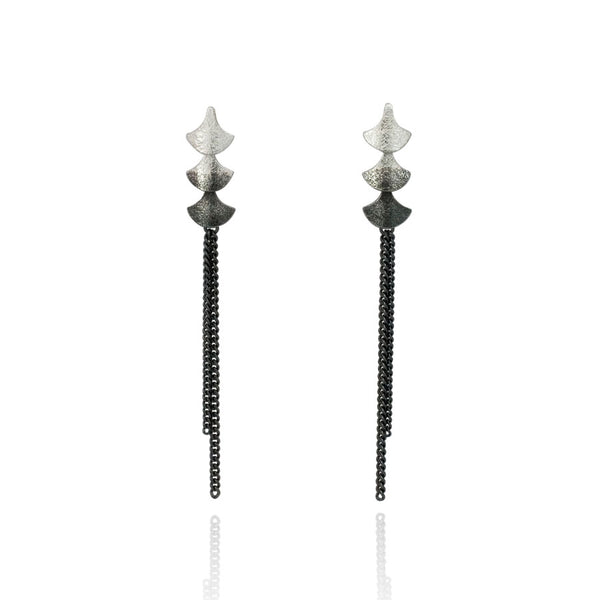 Silver shorter dangly earrings with oxidised chains and silver teardrop shapes.