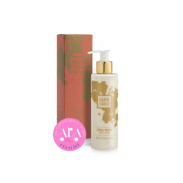coral and gold printed bottle and box of body lotion by Guava and Gold