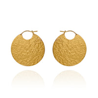 Large gold disc hoop style earrings with textured finish.