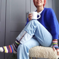 model wearing multicolour cashmere socks and handwarmers cropped