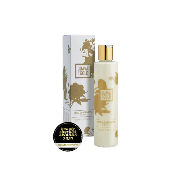 white and gold printed bottle and box of shampoo by Guava and Gold