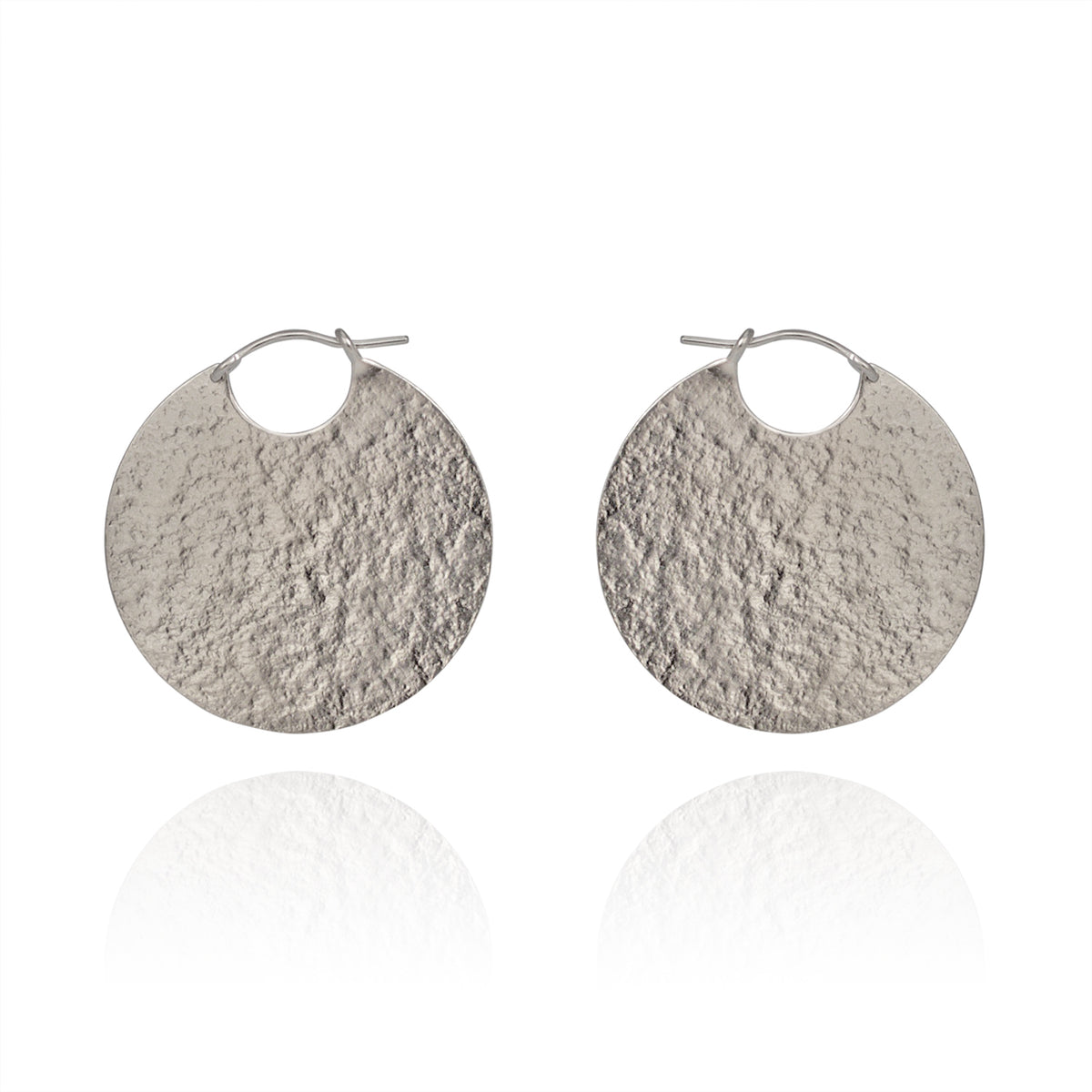 Large silver disc hoop textured earrings.