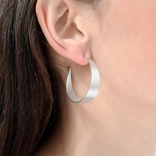 Silver Large Hoop Earrings on model by Cara Tonkin