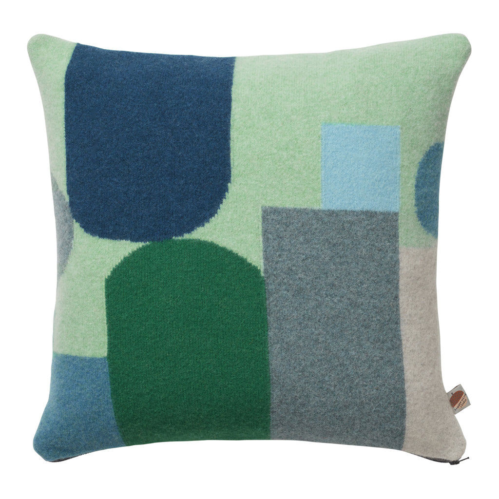 blues, greens, and grey geometric knitted cushion by Donna Wilson