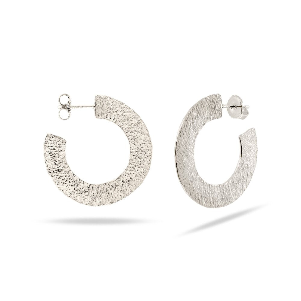silver hoop earring with stud and textured pattern at IndependentBoutique.com