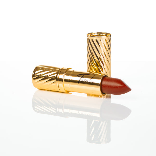 copper colour lipstick in gold embossed tube with black Fatale logo on side at IndependentBoutique.com