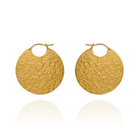 Large gold disc hoop style earrings with textured finish.