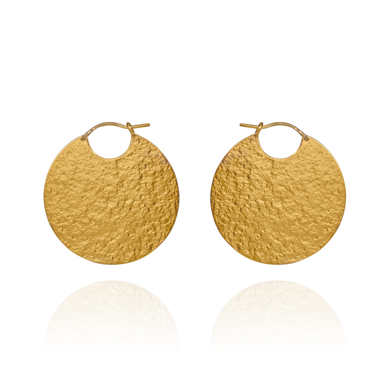 Large gold disc hoop style earrings with textured finish.