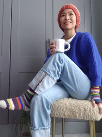 model wearing multicolour cashmere socks and handwarmers
