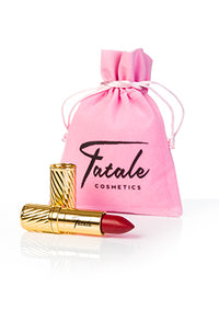 red lipstick in gold embossed tube with pink Fatale cosmetics bag at IndependentBoutique.com