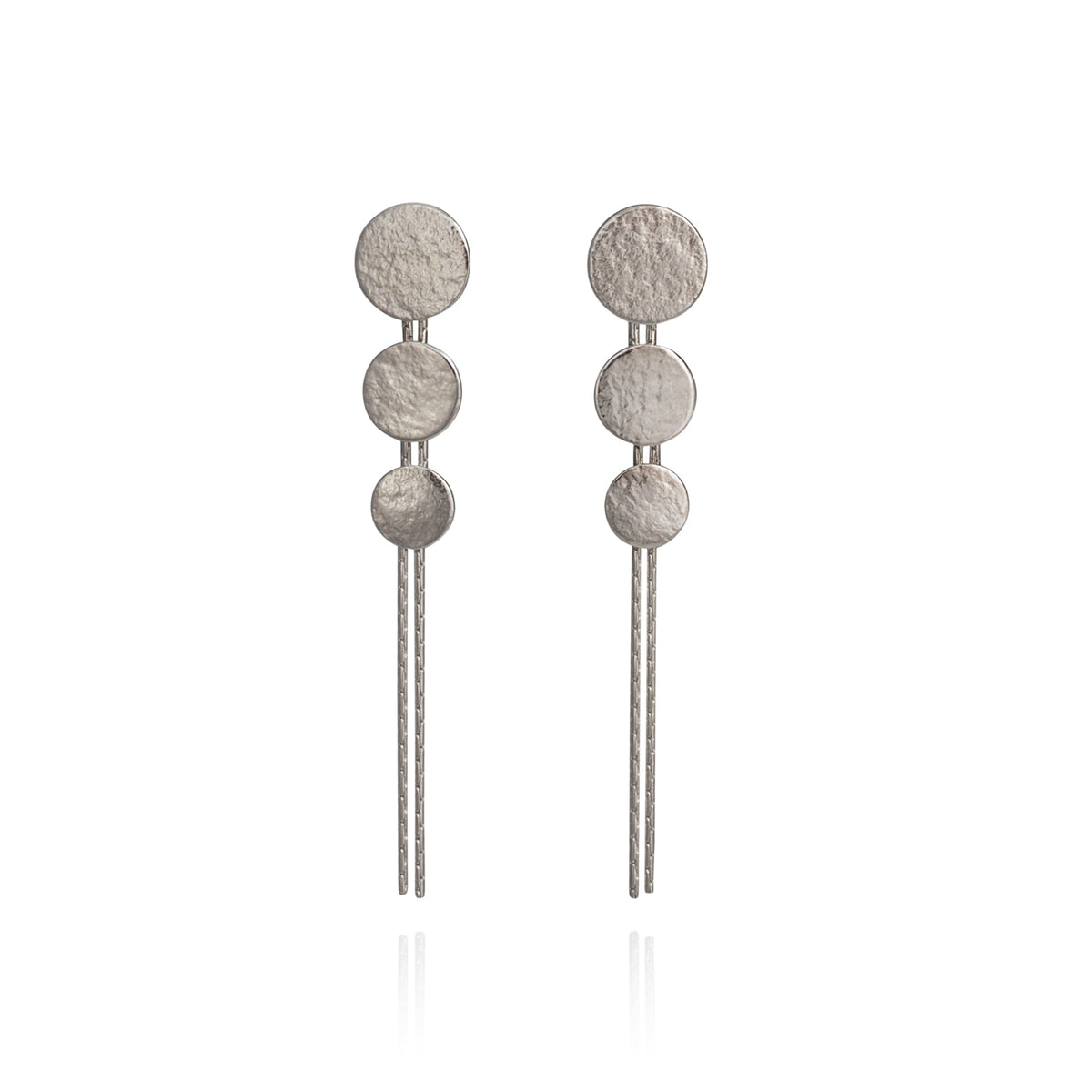 Silver triple disc drop earrings by British jewellery designer Cara Tonkin