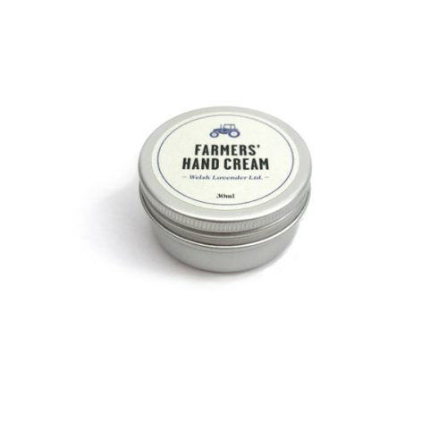 round silver tin with white label  and lid saying Farmers hand cream, Welsh Lavender.